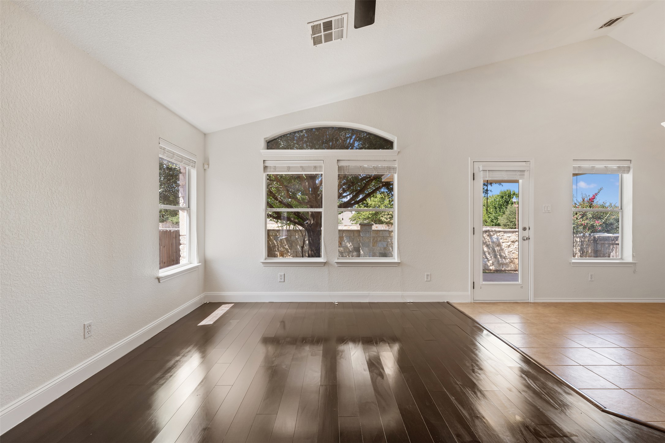 14316 Marathon Road Austin, TX 78717 - Photo 21 of 40 Polished bamboo floors and vaulted ceilings frame a spacious open living area.