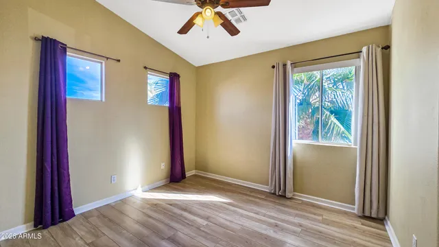 a view of a house with swimming pool and sitting area