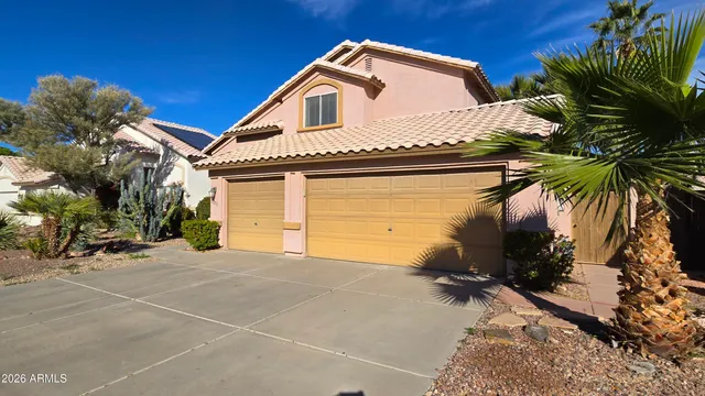 a view of a hallway with windows and stairs