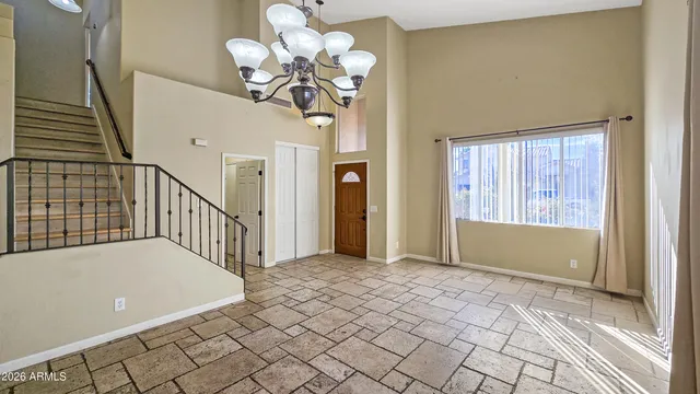 a view of a kitchen with cabinet and a refrigerator