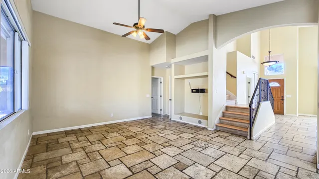 a kitchen with granite countertop a sink a stove and microwave