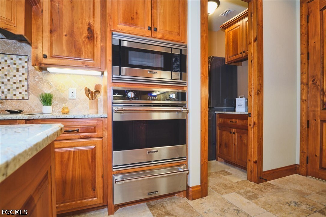 5306 Southwest 27th Place Cape Coral, FL 33914 - Photo 13 of 50 a kitchen with appliances and cabinets