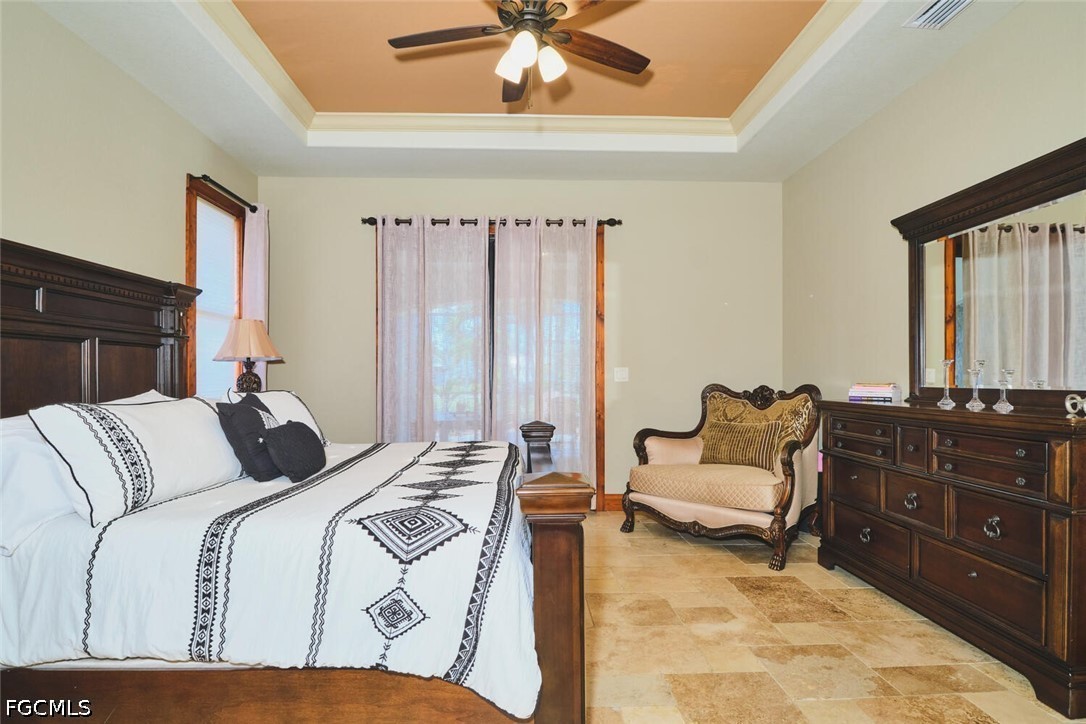 5306 Southwest 27th Place Cape Coral, FL 33914 - Photo 16 of 50 a bedroom with a bed and a couch