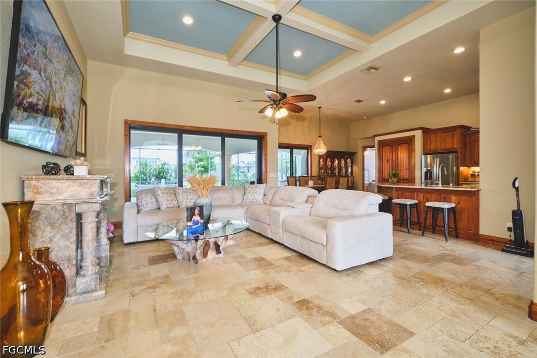 5306 Southwest 27th Place Cape Coral, FL 33914 - Photo 2 of 50 a living room with furniture and a flat screen tv