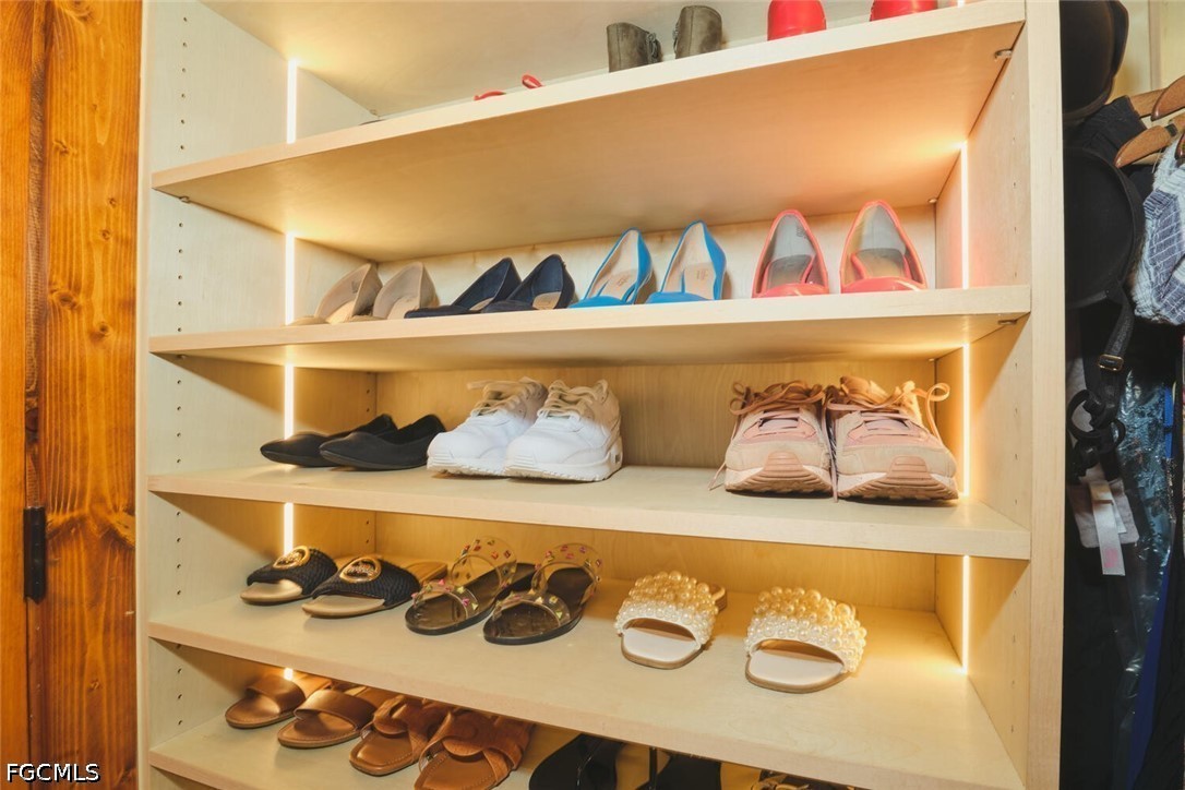 5306 Southwest 27th Place Cape Coral, FL 33914 - Photo 21 of 50 a front view of a bunch of shelves