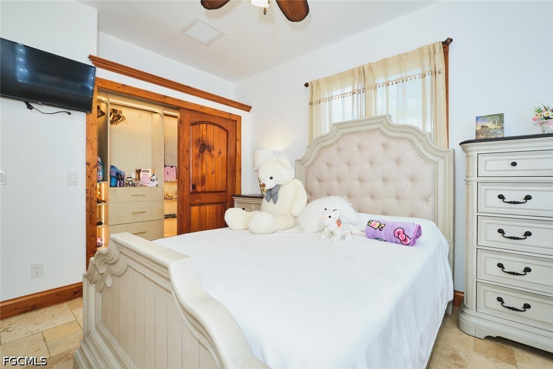 5306 Southwest 27th Place Cape Coral, FL 33914 - Photo 25 of 50 a bedroom with a bed and a dresser