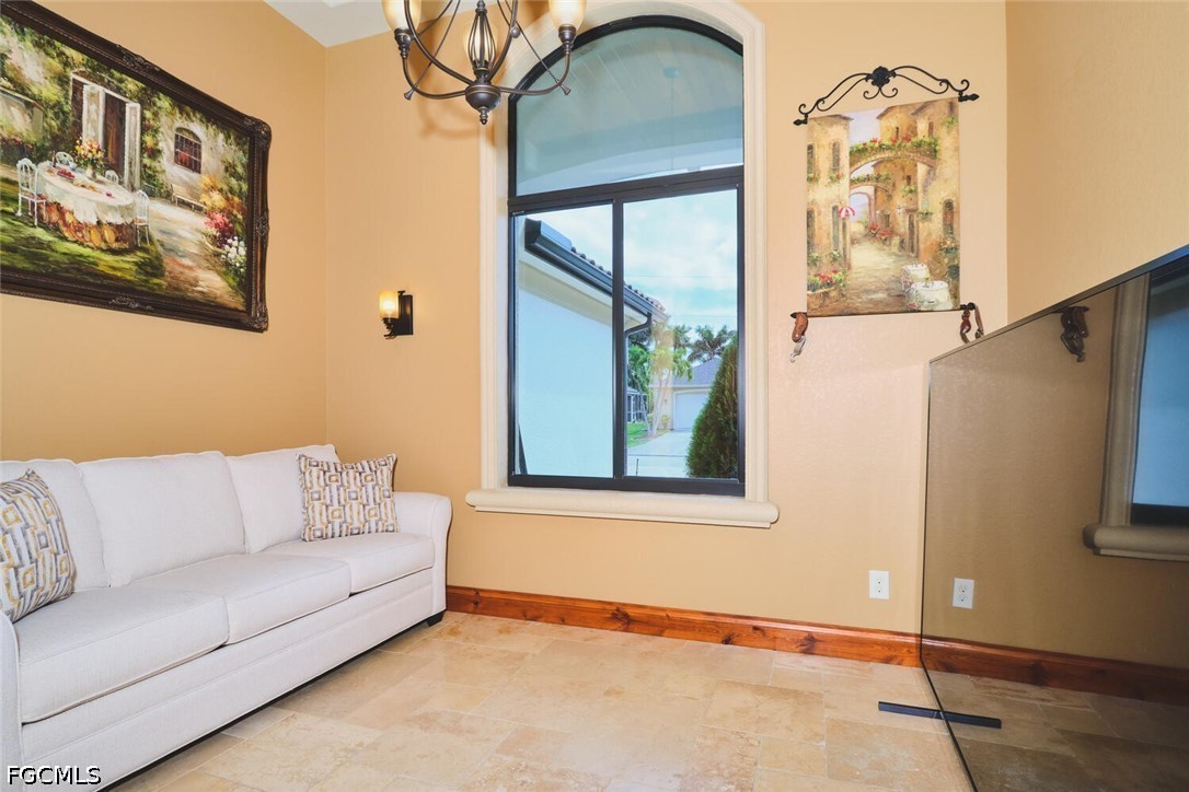 5306 Southwest 27th Place Cape Coral, FL 33914 - Photo 27 of 50 a living room with furniture and a window