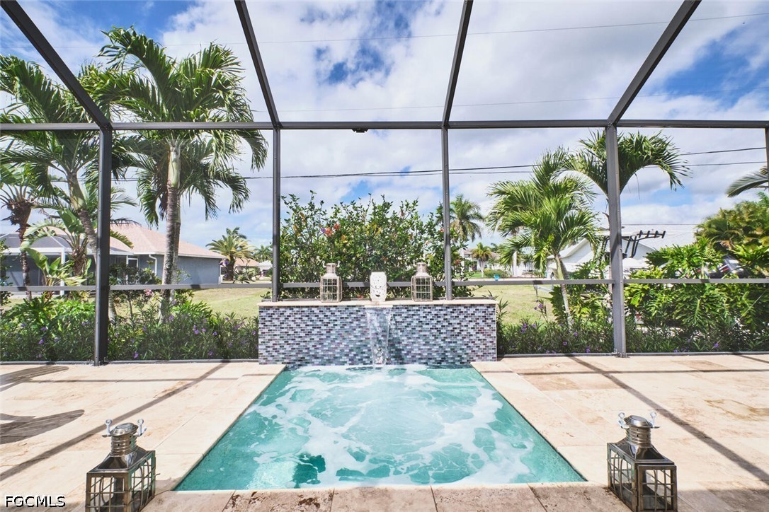 5306 Southwest 27th Place Cape Coral, FL 33914 - Photo 36 of 50 a view of a yard and a fountain in the background