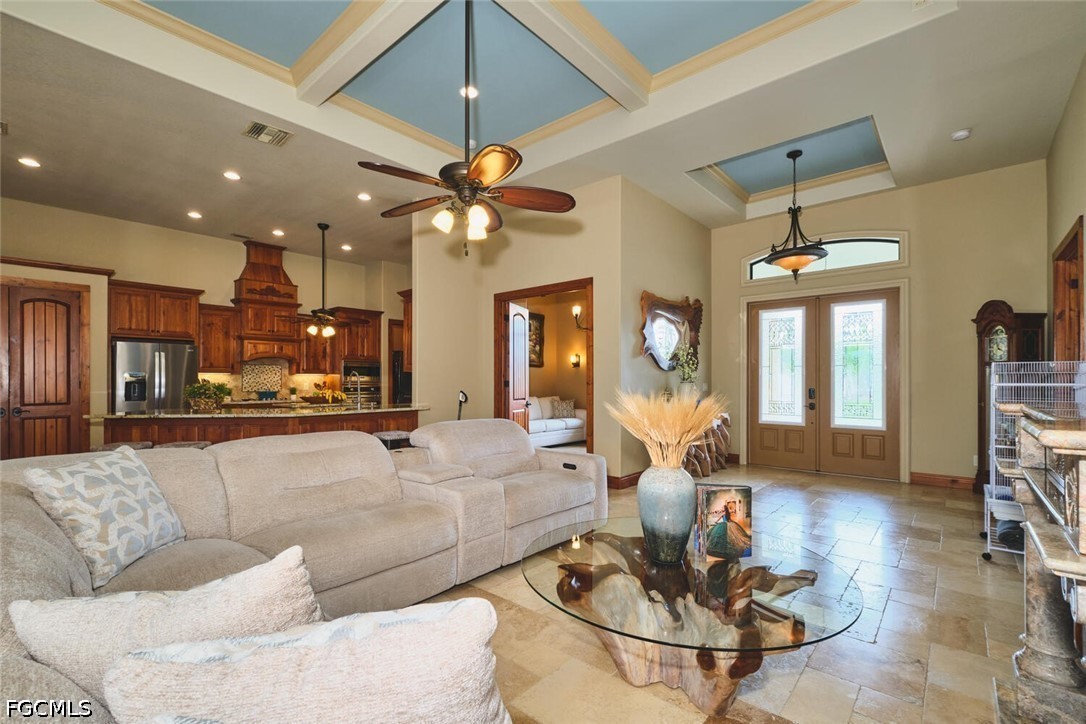 5306 Southwest 27th Place Cape Coral, FL 33914 - Photo 4 of 50 a living room with furniture kitchen view and a chandelier