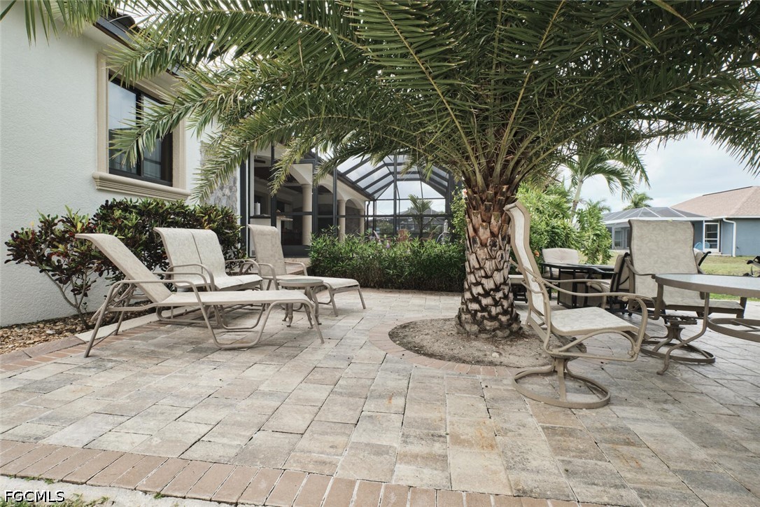 5306 Southwest 27th Place Cape Coral, FL 33914 - Photo 44 of 50 a view of a patio with a table and chairs