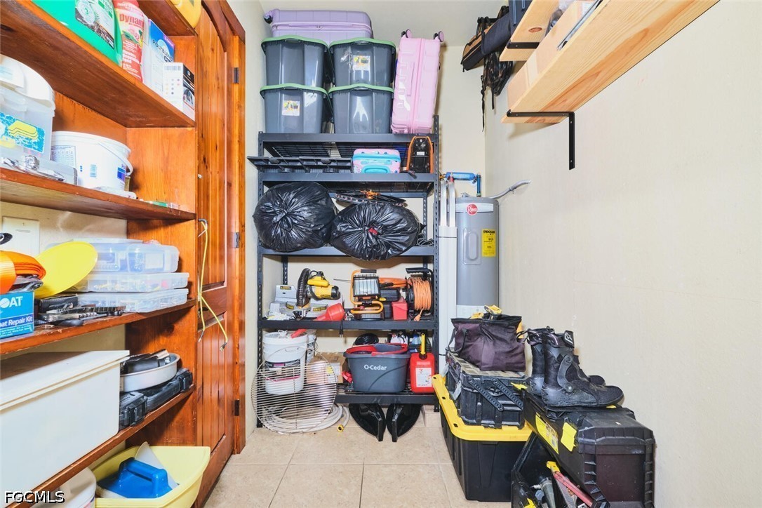 5306 Southwest 27th Place Cape Coral, FL 33914 - Photo 46 of 50 a room with lots of different colored cloths