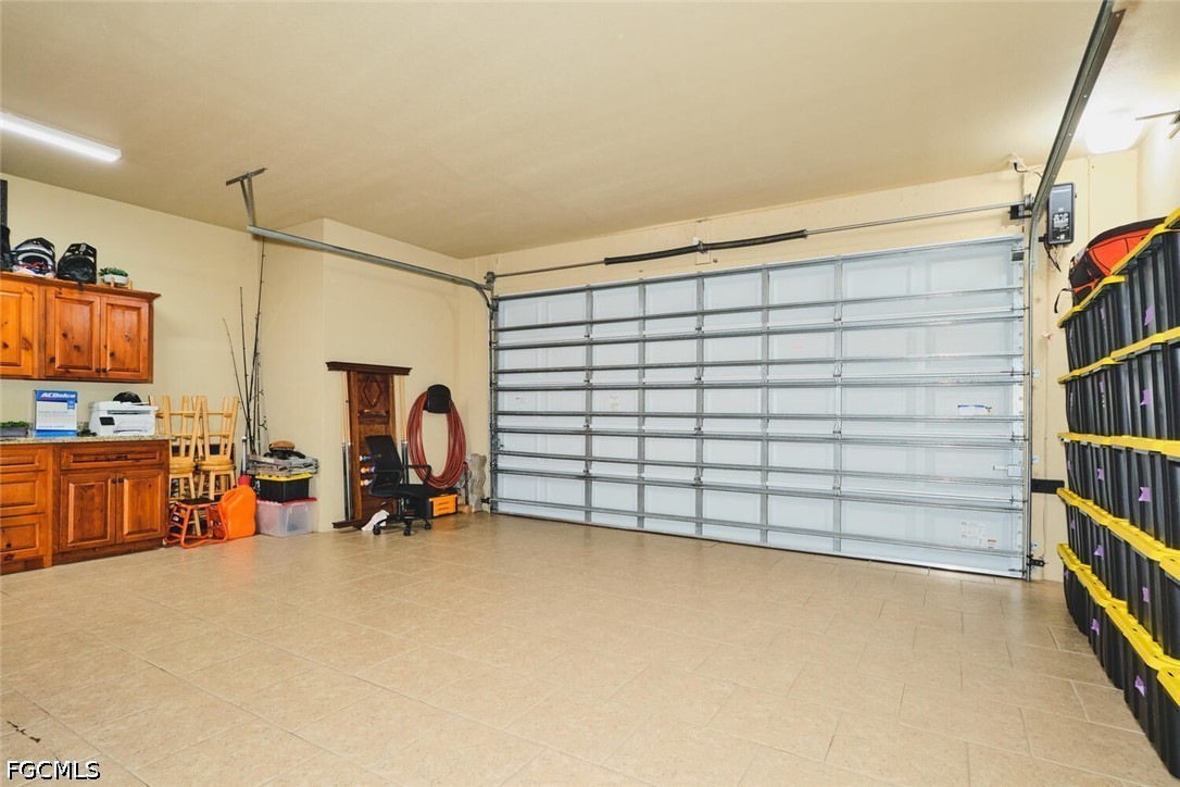 5306 Southwest 27th Place Cape Coral, FL 33914 - Photo 50 of 50 a view of a room with gym equipment and a large window