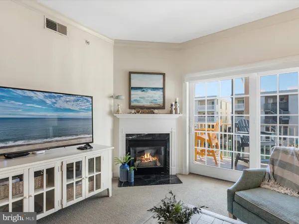 a kitchen with stainless steel appliances granite countertop a stove a sink a microwave a dining table and chairs