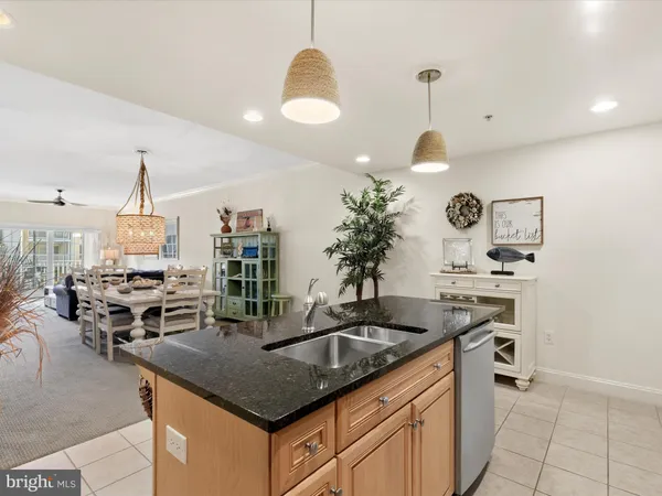 a very nice looking room with a large window and chandelier