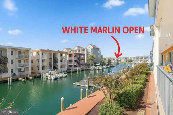 a view of a lake with building in front of it