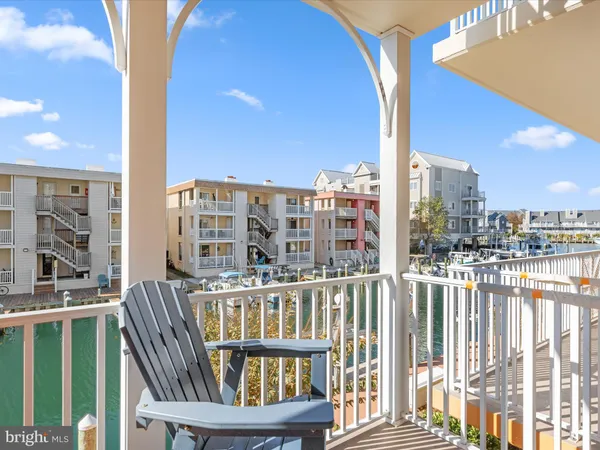 a bathroom with a granite countertop sink a toilet and a shower