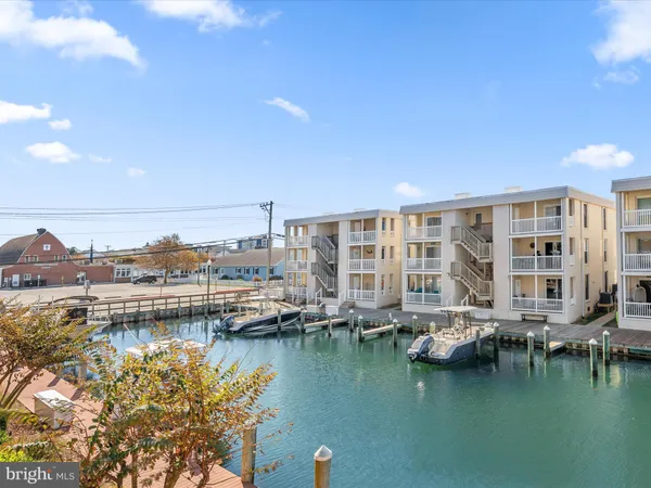 a bathroom with a light fixture and a mirror