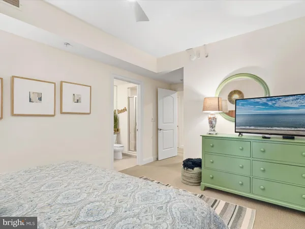 an aerial view of a house with a garden and lake view