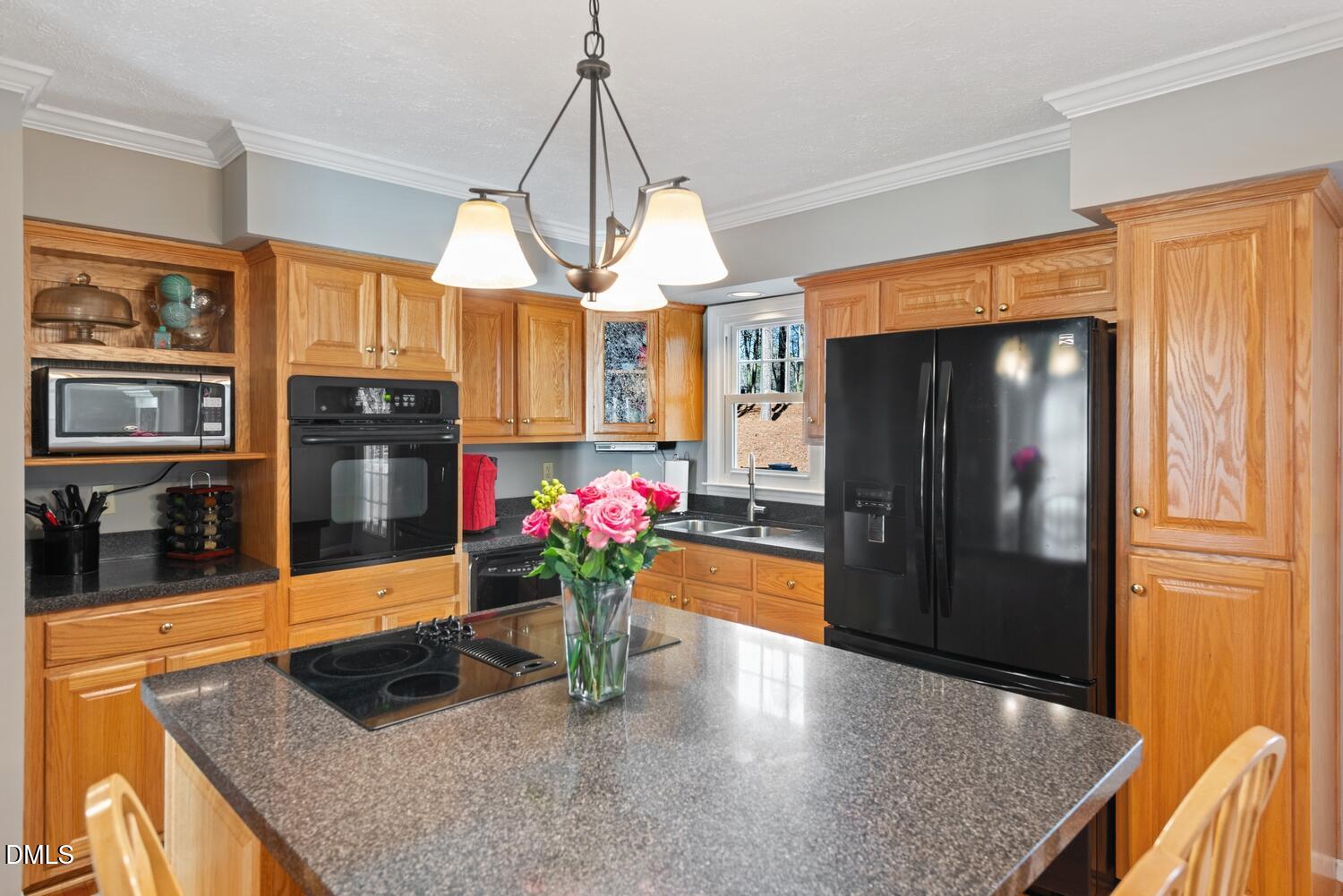 1832 Jimmie Kerr Road Haw River, NC 27258 - Photo 11 of 39 a kitchen with stainless steel appliances granite countertop a refrigerator a stove and a sink