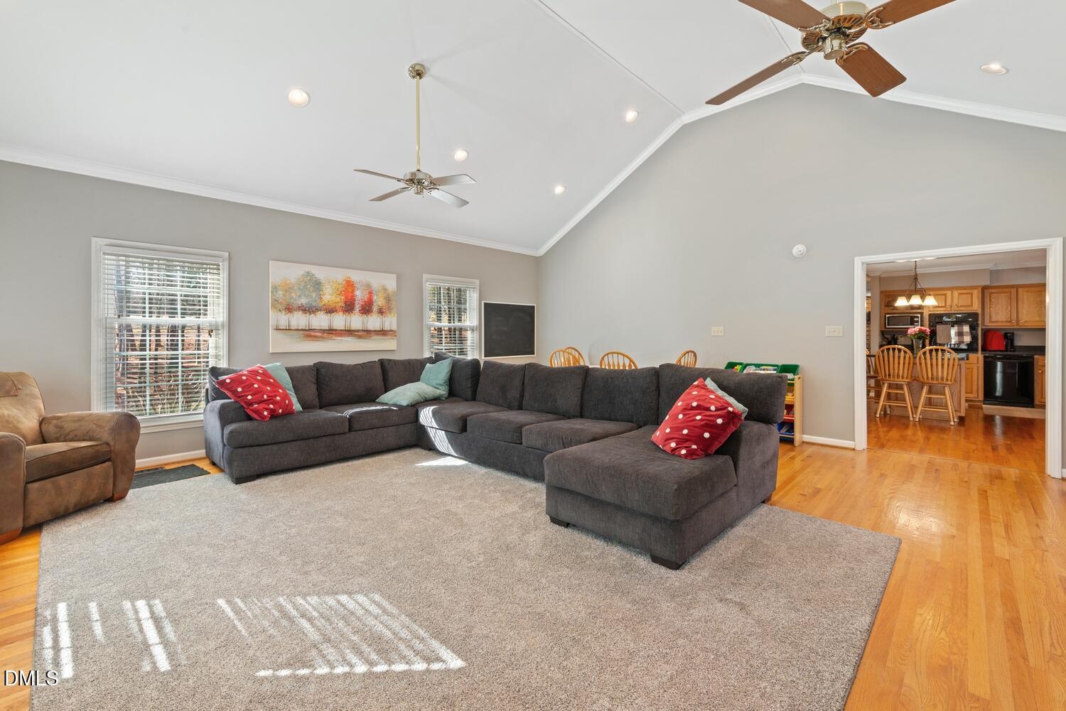 1832 Jimmie Kerr Road Haw River, NC 27258 - Photo 16 of 39 a living room with furniture and a wooden floor