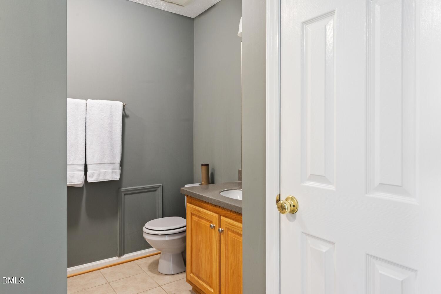 1832 Jimmie Kerr Road Haw River, NC 27258 - Photo 22 of 39 a bathroom with a granite countertop toilet a sink and a shower