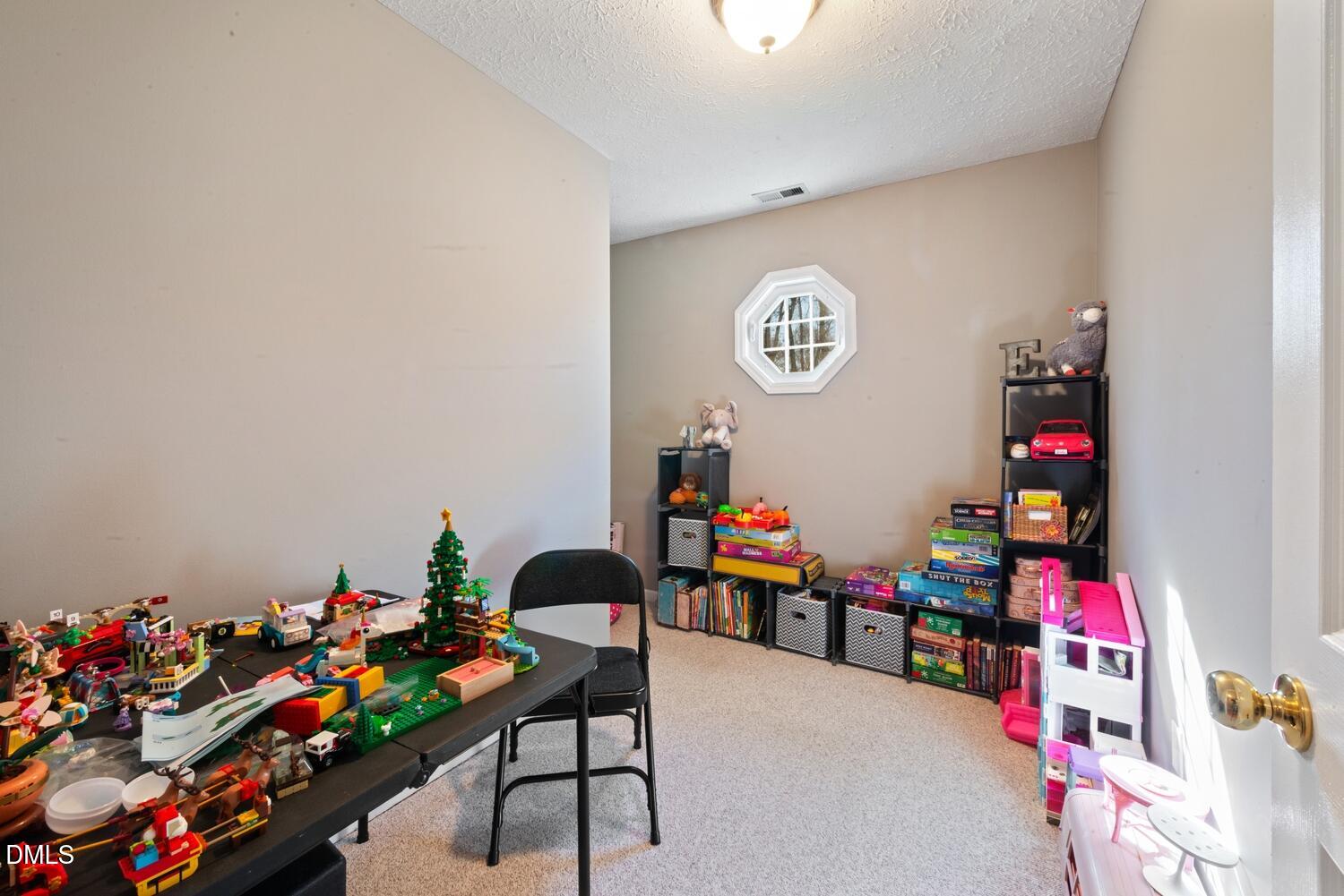 1832 Jimmie Kerr Road Haw River, NC 27258 - Photo 27 of 39 a group of people sitting in a room