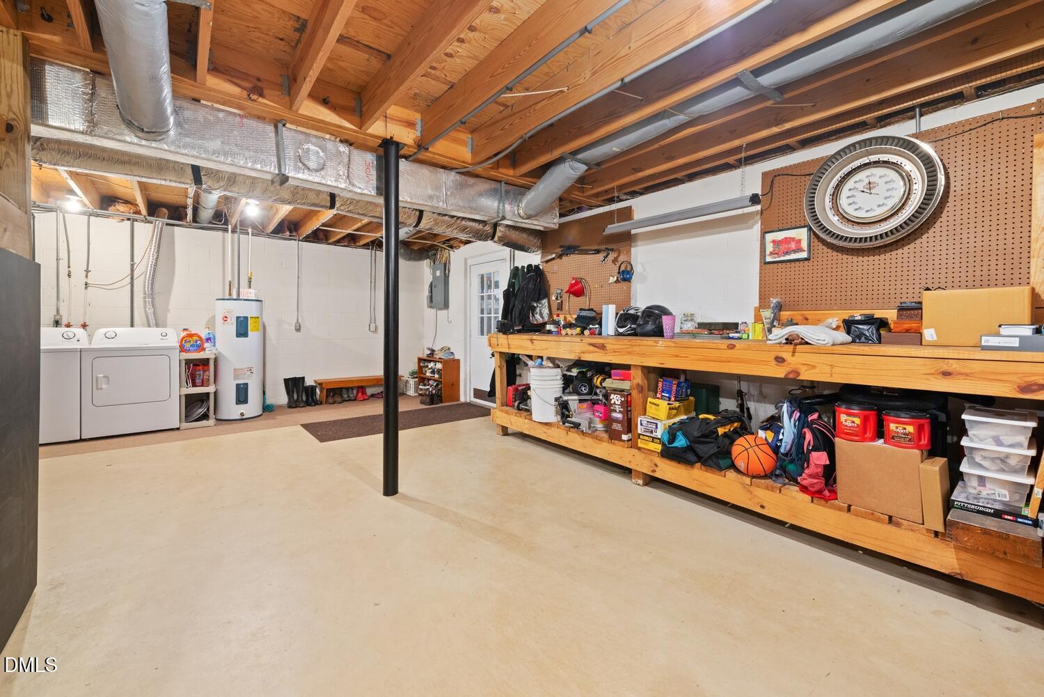 1832 Jimmie Kerr Road Haw River, NC 27258 - Photo 28 of 39 a utility room with lots of wooden furniture