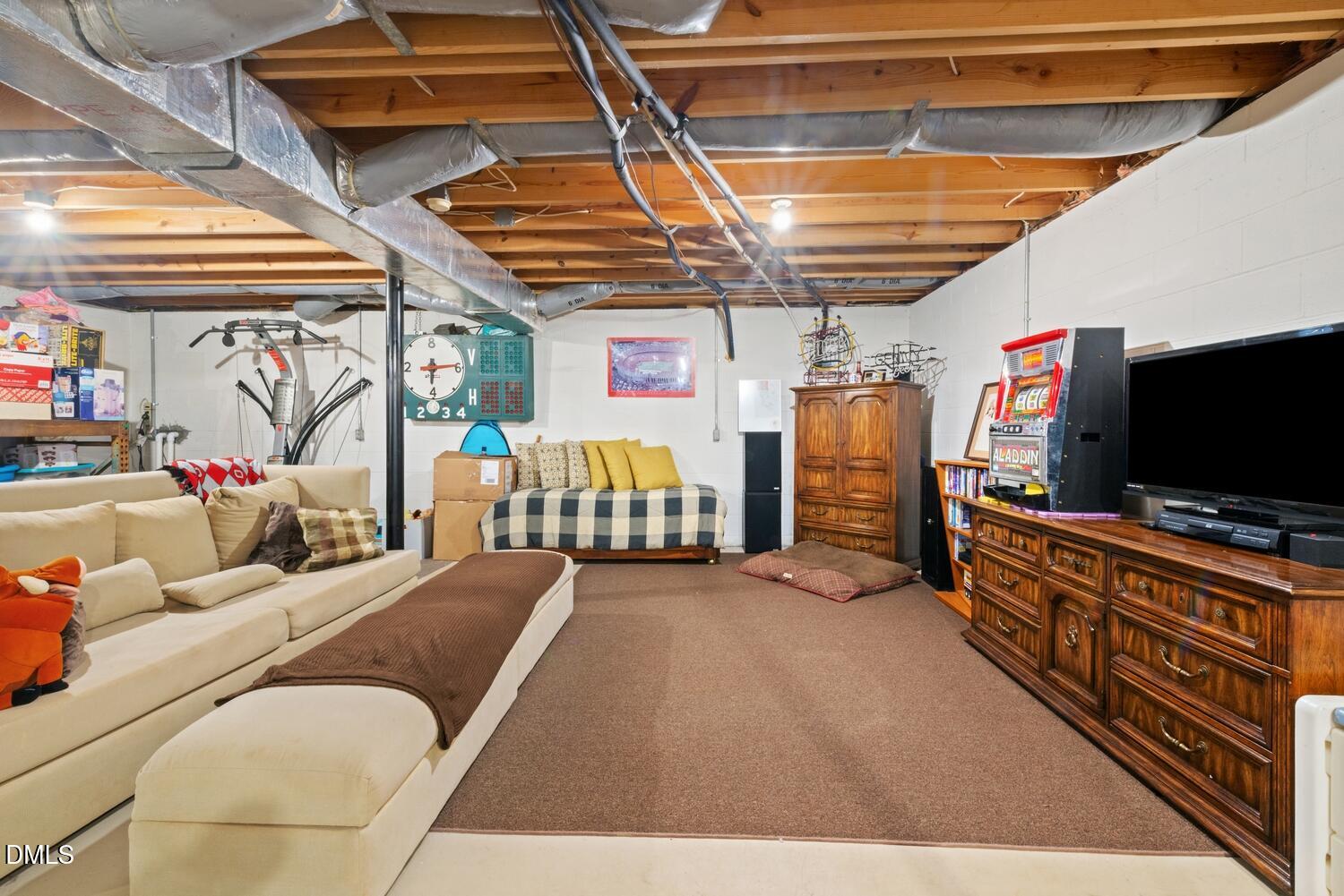 1832 Jimmie Kerr Road Haw River, NC 27258 - Photo 30 of 39 a living room with furniture and a flat screen tv