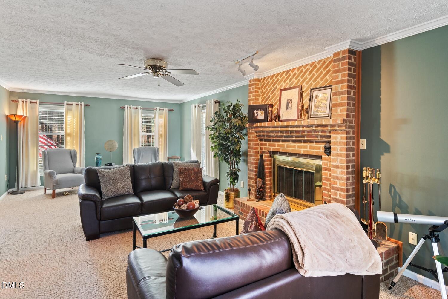 1832 Jimmie Kerr Road Haw River, NC 27258 - Photo 7 of 39 a living room with furniture a fireplace and a large window