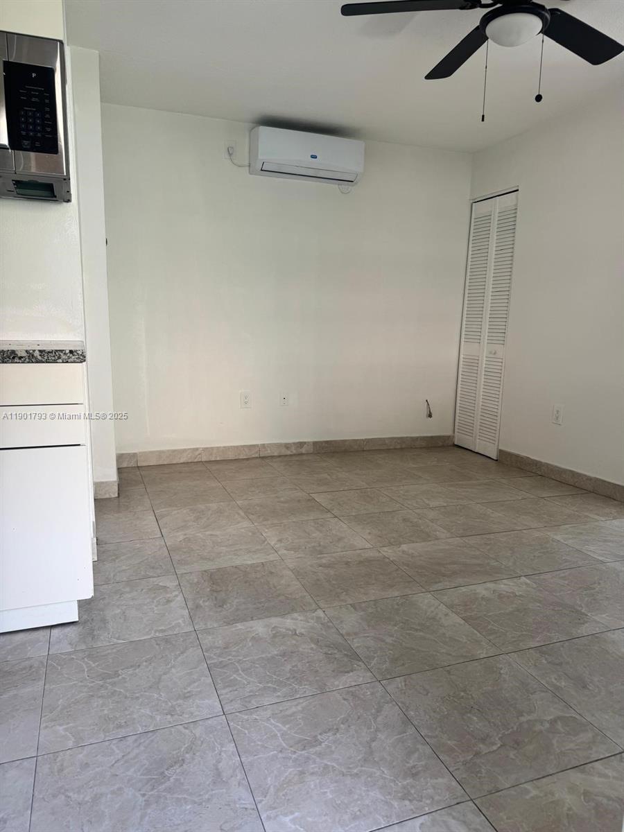 1036 Northwest 3rd Street, Unit 1 Miami, FL 33128 - Photo 13 of 22 a view of an empty room with a window