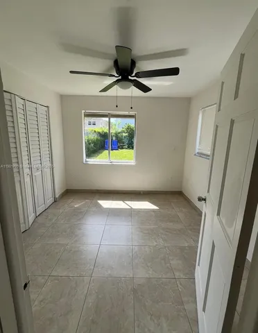 a view of an empty room and window
