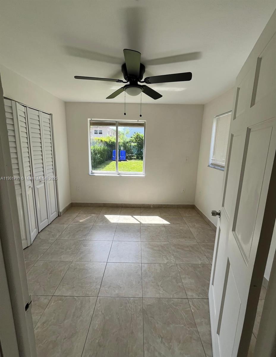 1036 Northwest 3rd Street, Unit 1 Miami, FL 33128 - Photo 15 of 22 a view of an empty room and window