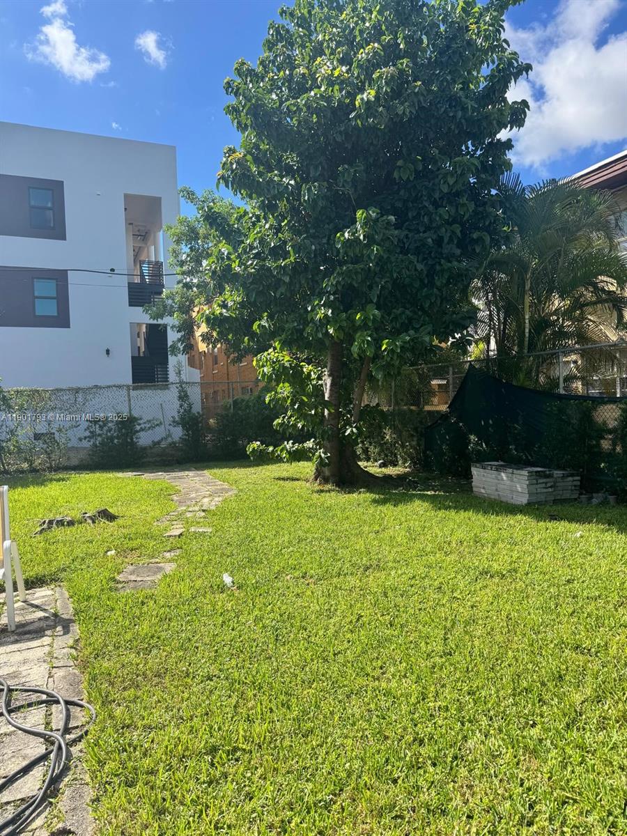 1036 Northwest 3rd Street, Unit 1 Miami, FL 33128 - Photo 20 of 22 a view of a backyard