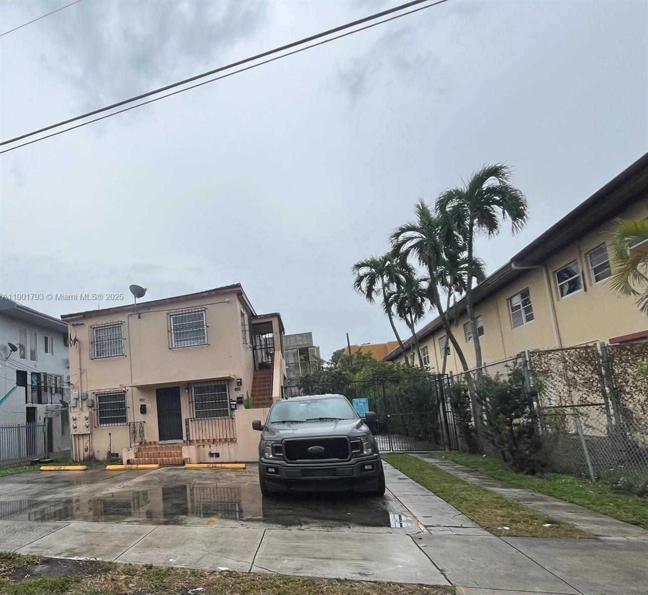 1036 Northwest 3rd Street, Unit 1 Miami, FL 33128 - Photo 2 of 22 a car parked in front of a building