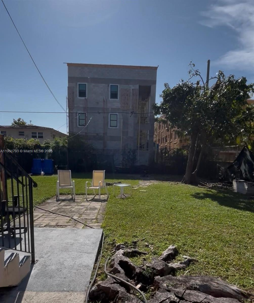 1036 Northwest 3rd Street, Unit 1 Miami, FL 33128 - Photo 22 of 22 a backyard of a house with lots of green space