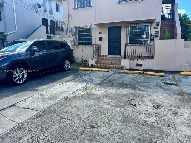 a car parked in front of a house