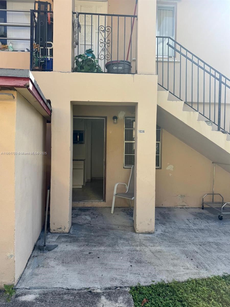 1036 Northwest 3rd Street, Unit 1 Miami, FL 33128 - Photo 9 of 22 a view of a patio with table and chairs