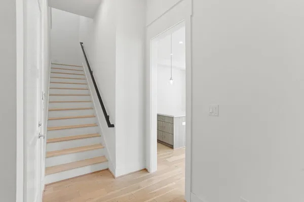 a view of a hallway with staircase