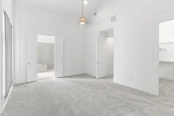 an empty room with a bathroom