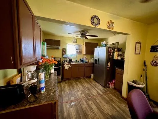 a kitchen with granite countertop lots of counter top space