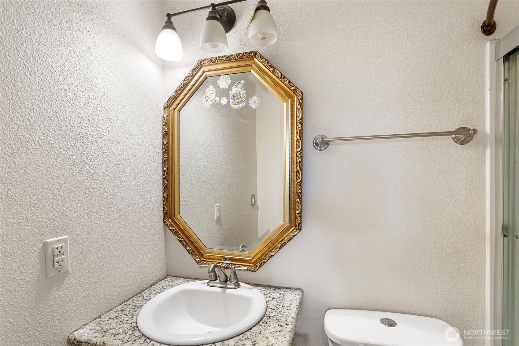 1901 South Plum Street Seattle, WA 98144 - Photo 12 of 14 a bathroom with a toilet mirror vanity and a sink