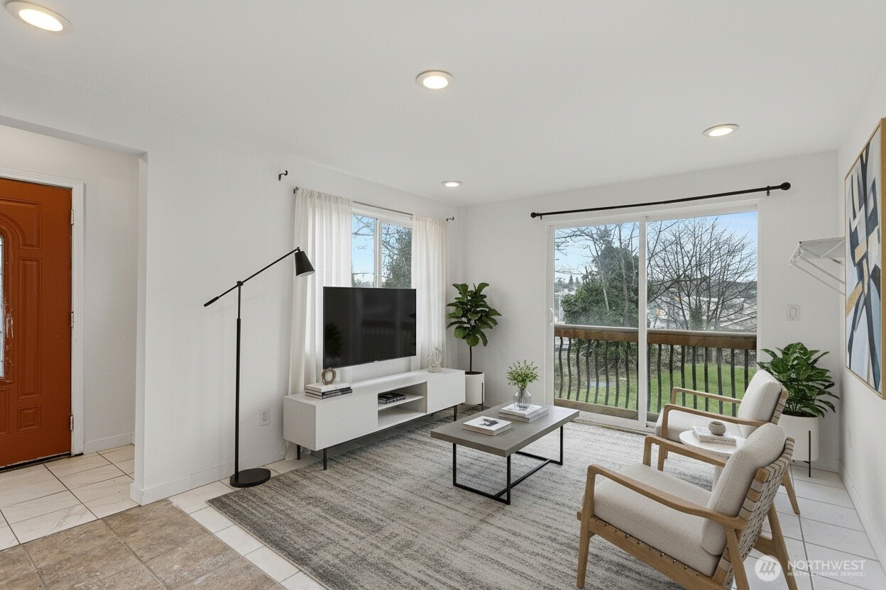 1901 South Plum Street Seattle, WA 98144 - Photo 3 of 14 a living room with furniture and a flat screen tv