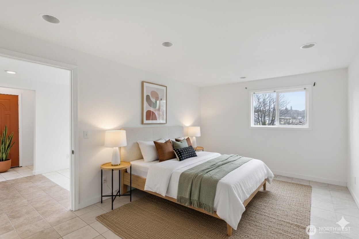 1901 South Plum Street Seattle, WA 98144 - Photo 8 of 14 a bedroom with a bed and a night stand