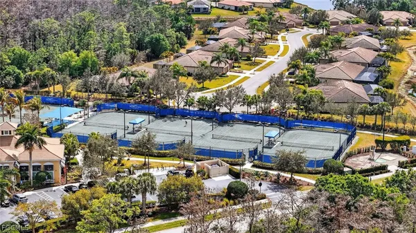 an aerial view of a houses with yard