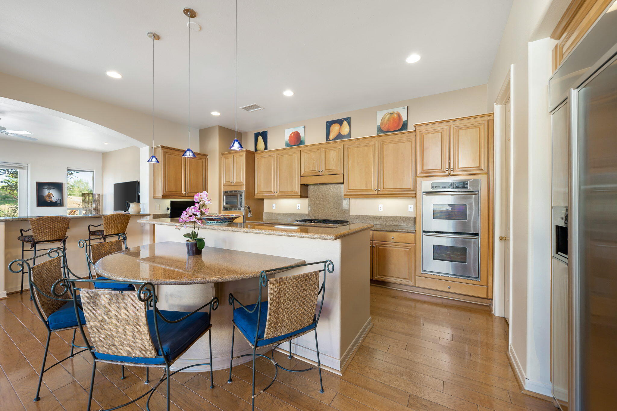 372 Loch Lomond Road Rancho Mirage, CA 92270 - Photo 13 of 51 a kitchen with a dining table chairs and refrigerator