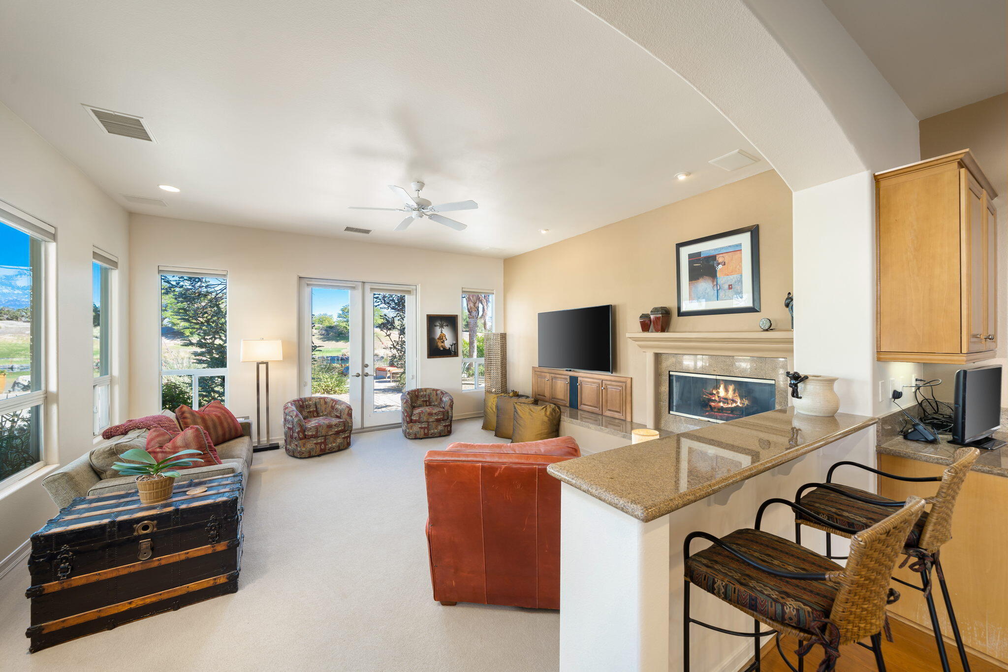 372 Loch Lomond Road Rancho Mirage, CA 92270 - Photo 17 of 51 a living room with furniture a fireplace and a flat screen tv