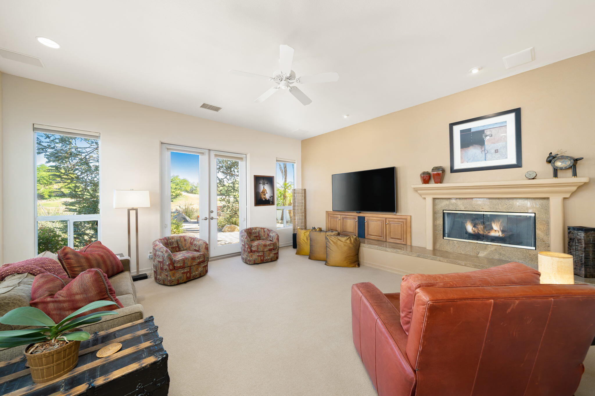 372 Loch Lomond Road Rancho Mirage, CA 92270 - Photo 18 of 51 a living room with furniture a flat screen tv and a fireplace