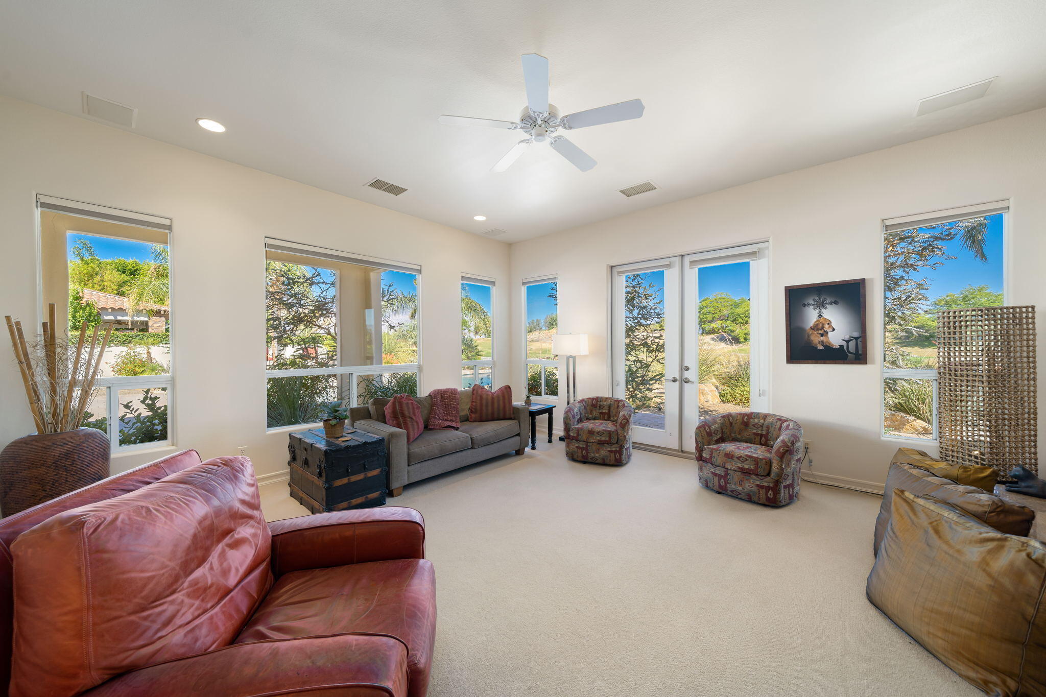 372 Loch Lomond Road Rancho Mirage, CA 92270 - Photo 19 of 51 a living room with furniture ceiling fan and a window