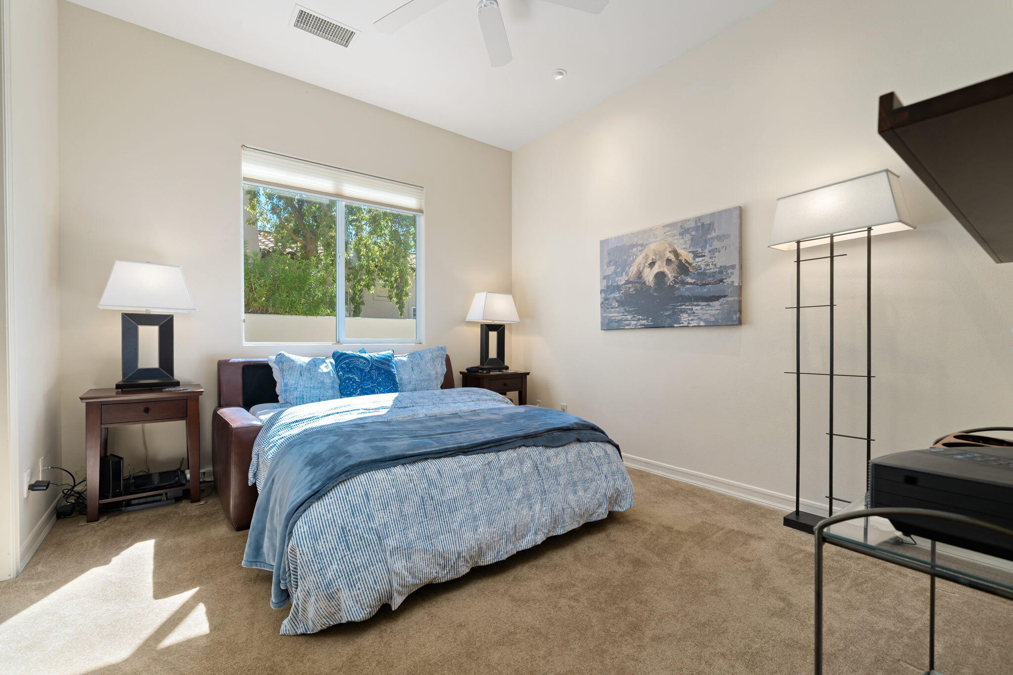 372 Loch Lomond Road Rancho Mirage, CA 92270 - Photo 22 of 51 a bedroom with a bed and a window