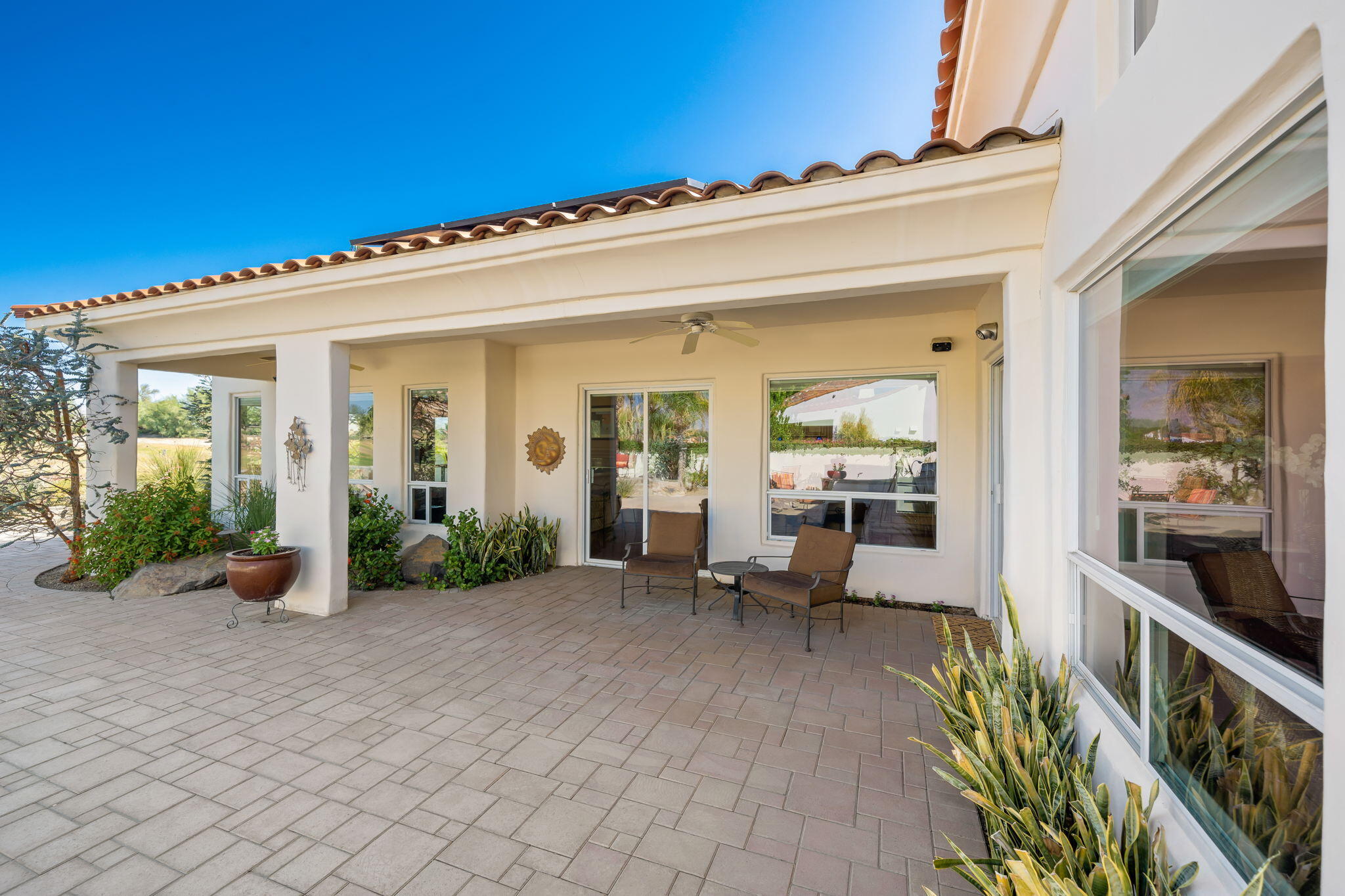 372 Loch Lomond Road Rancho Mirage, CA 92270 - Photo 33 of 51 a view of a patio with table and chairs in front of it